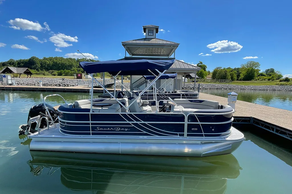 Pontoon boat cruising on Watts Bar Lake in East Tennessee