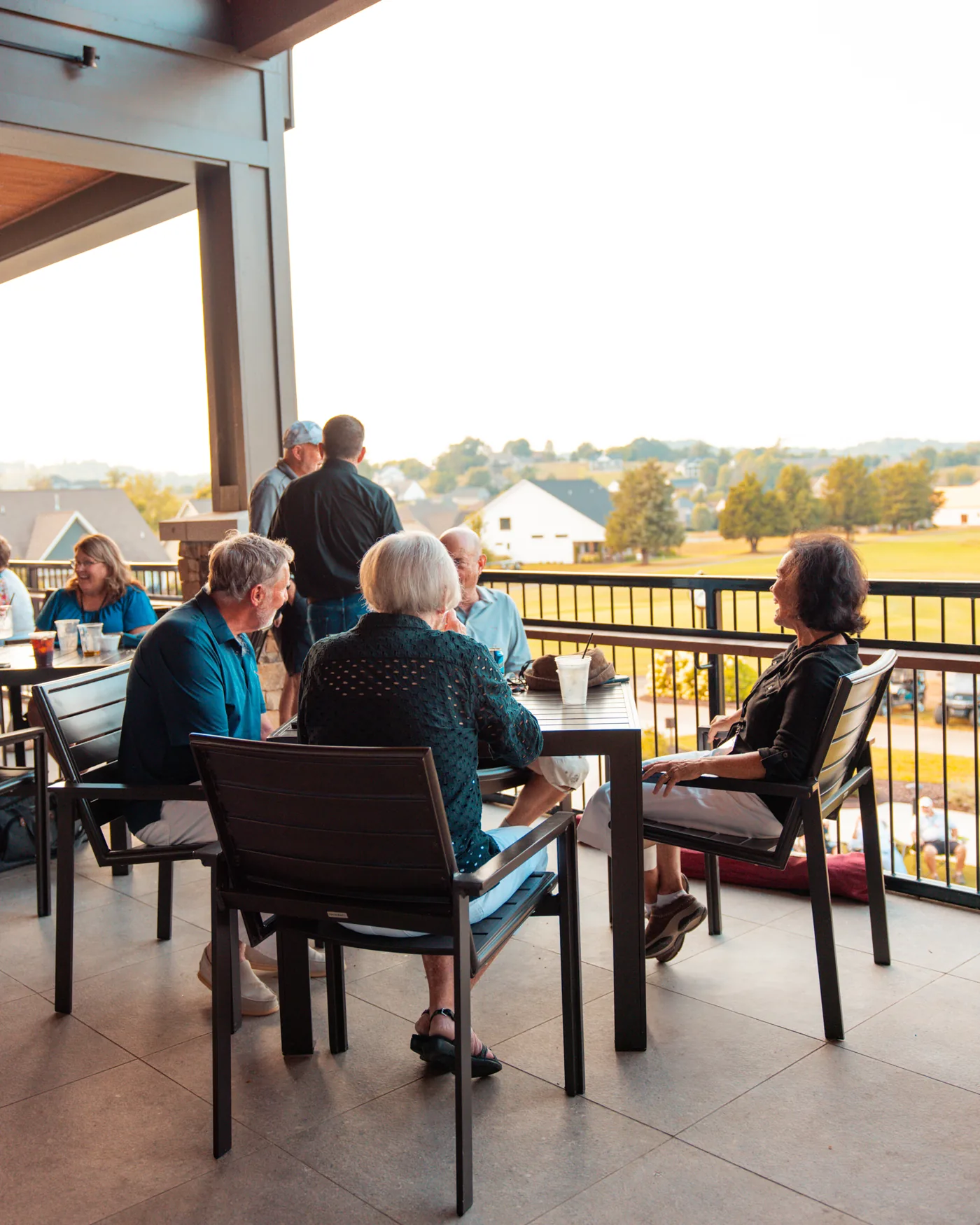 Residents together on the lakeview patio at Tennessee National